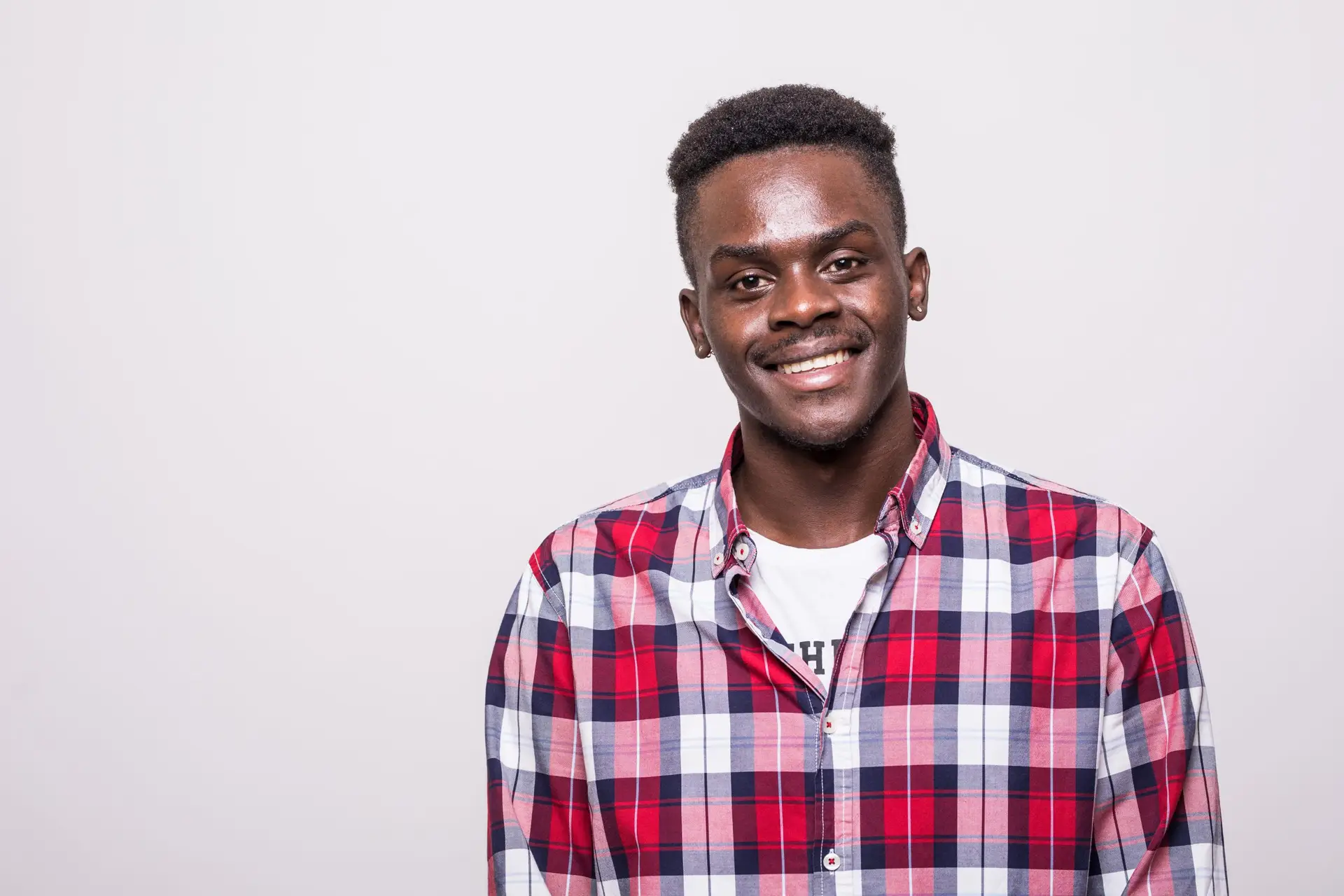 young handsome african business man posing isolated over white